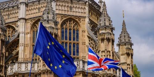 EU and UK flags outside Houses of Parliament